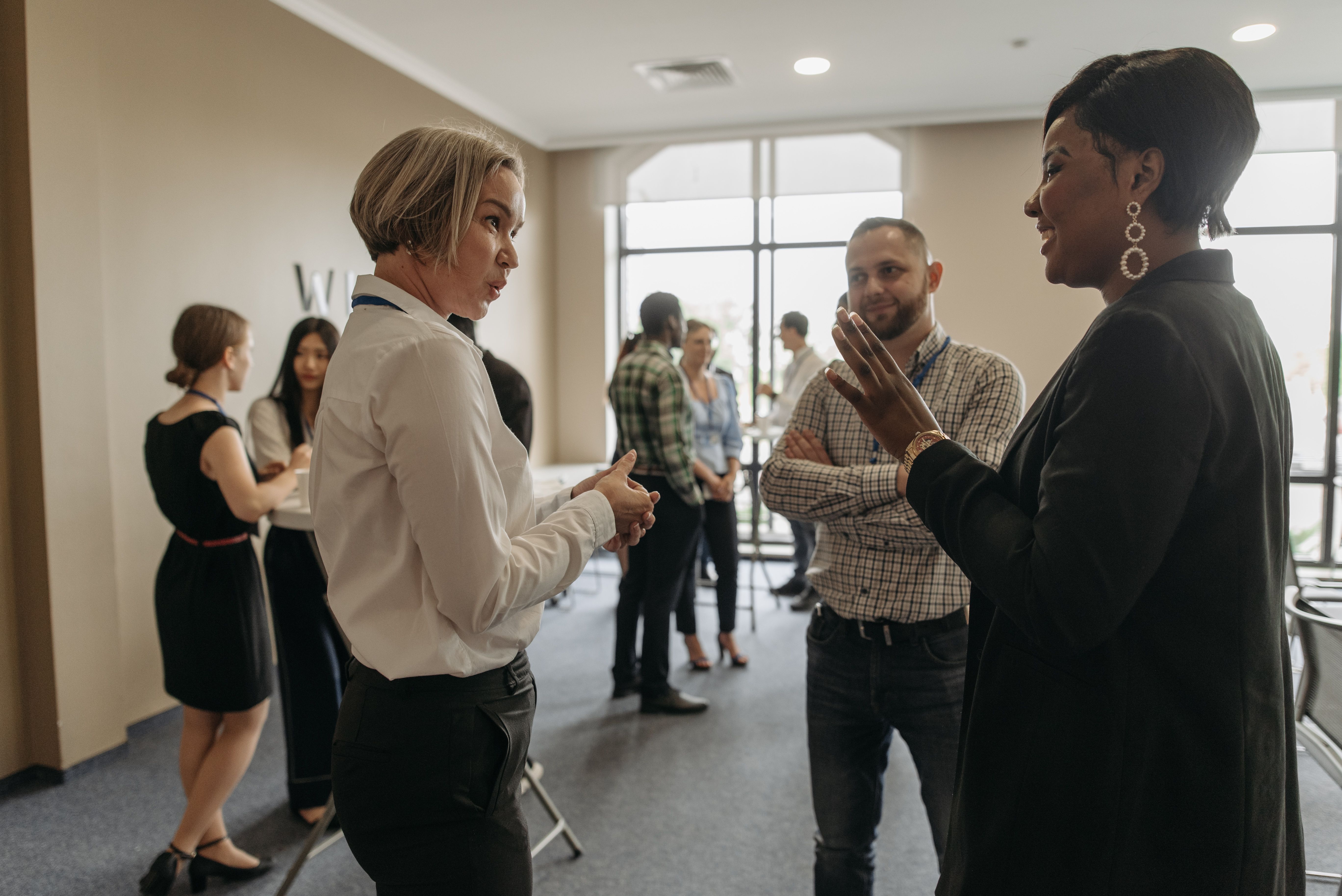 Professionals networking and reading group dynamics at a corporate event